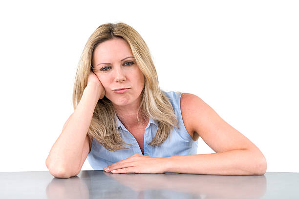 sad woman sitting at desk