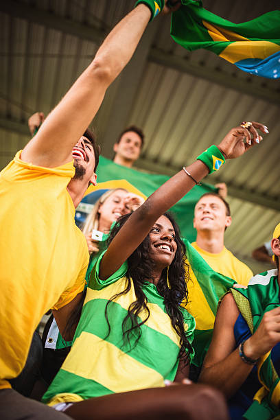 istock Group of brazilian supporters at stadium 186745611