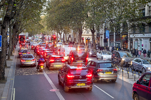 Southampton Row, London, England - November 11th 2023:  Intense traffic with brake lights at a late afternoon seen from the upper level of a double-decker bus