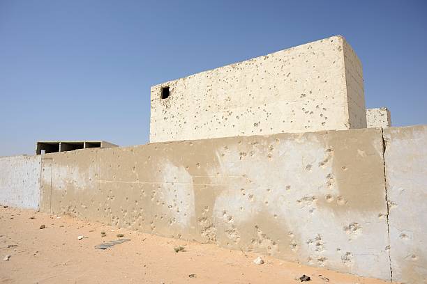 istock The building with potholes after bullet shooting 186746383