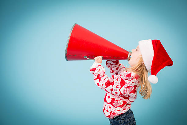 istock Santa's Little Helper Making Announcement With Megaphone 186746562