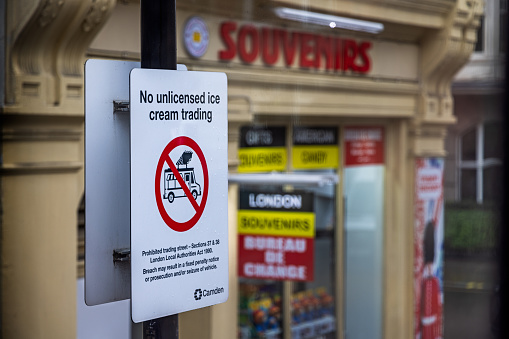 Great Russel Street, London, England - November 10th 2023:  Poster informing that unlicensed ice cream selling is not legal opposite the British Museum. The picture is taken from the upper level of a double-decker bus