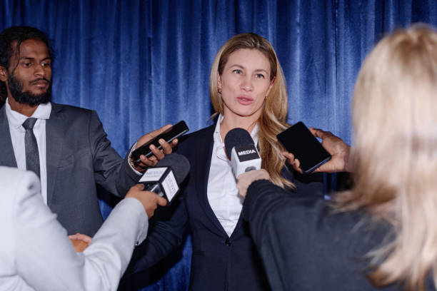 istock Businesswoman giving an interview to journalists 1867489401
