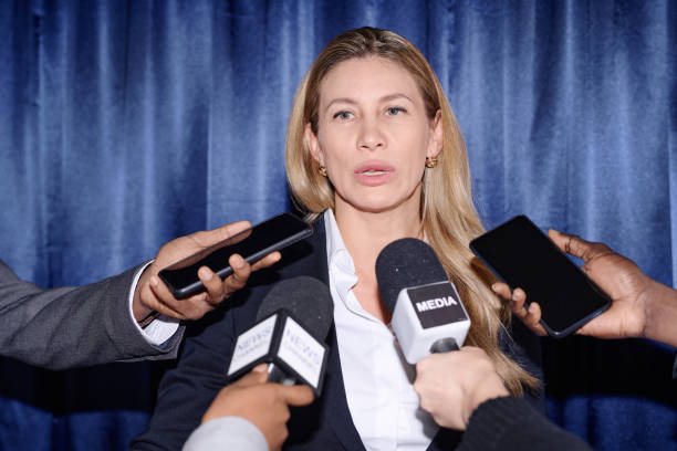 istock Businesswoman talking to journalists 1867489402