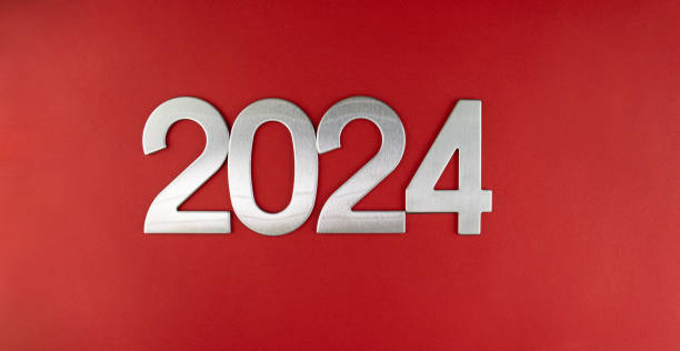 istock Composition with the number 2024 in silver, metal on a red monochrome background 1867490438