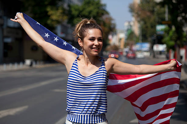 istock young woman with USA flag 186749133