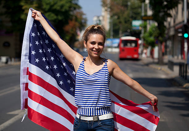 istock young woman with USA flag 186749135