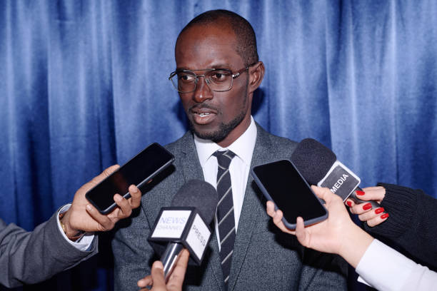 istock Businessman giving an interview at press conference 1867494070