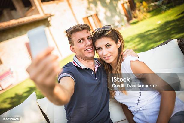 Couple Take A Snapshot With The Smartphone Stock Photo - Download Image Now - 20-29 Years, Adult, Adults Only