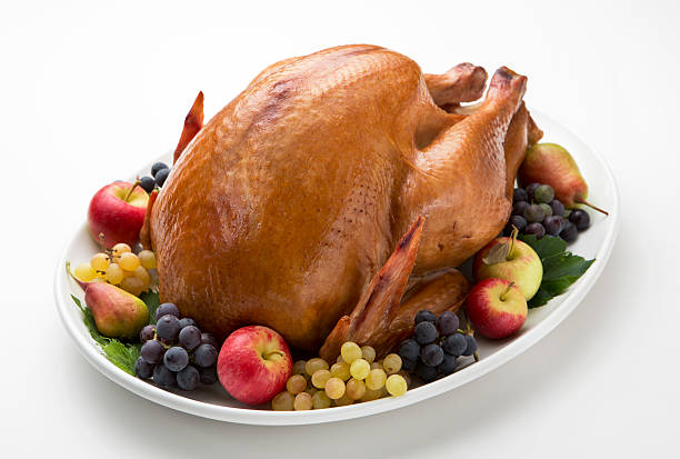 istock Roast Turkey on White Platter with Apples, Pears and Grapes. 186749700