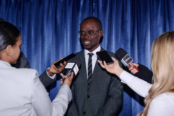 istock Businessman presenting at press conference 1867497147