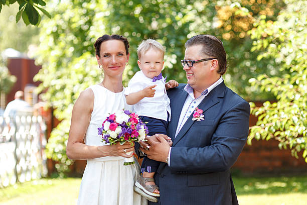 istock Happy Newlyweds with their son 186749906
