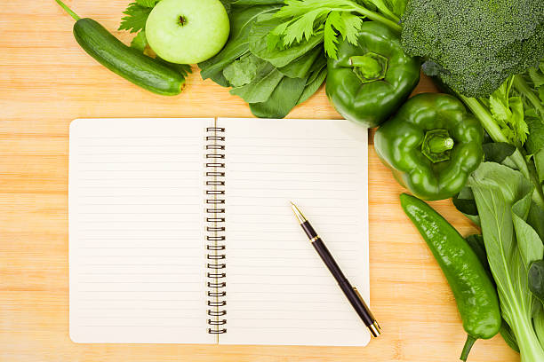 istock healthy eating:green vegetable and recipe on wood 186750065
