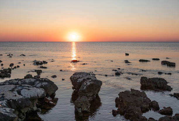 istock Rocks on sea in sunset 1867515546