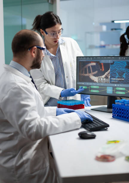 istock Scientist team discussing coronavirus discovery analyzing biomedical expertise 1867526051