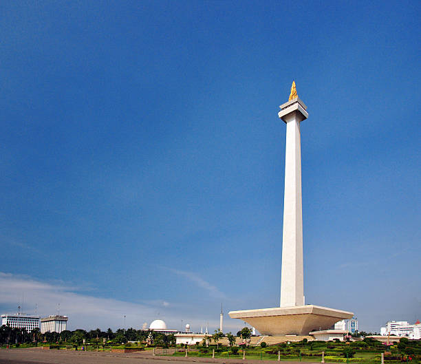 Jakarta, Indonesia: Monas tower Jakarta, Indonesia: Monas tower and Merdeka Square - blue sky with copy space - photo by M.Torres jakarta stock pictures, royalty-free photos & images