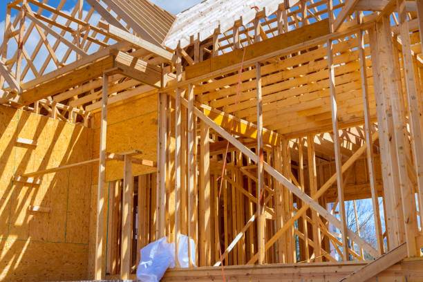 istock Framing beams at wooden framework construction of new house under construction a home 1867534437