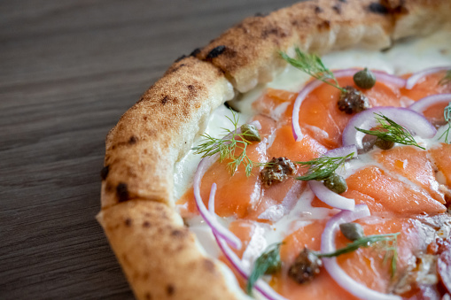 Close up of Smoked Salmon Pizza on the table.