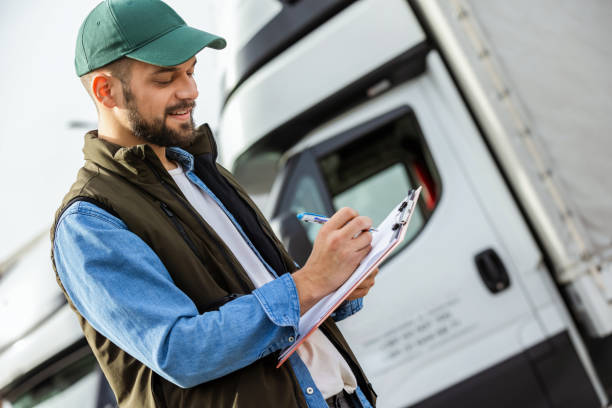 istock Happy confident male driver standing in front on his truck 1867543928