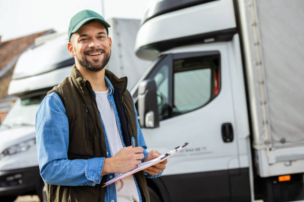 istock Happy confident male driver standing in front on his truck 1867543932