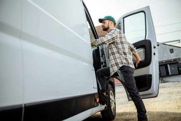 istock Young handsome man getting in his truck. 1867545491