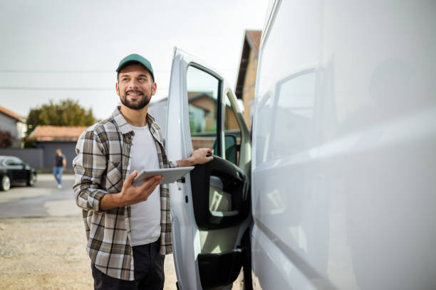 istock Young handsome man  checking if he did all his delivery on a paper. 1867545506