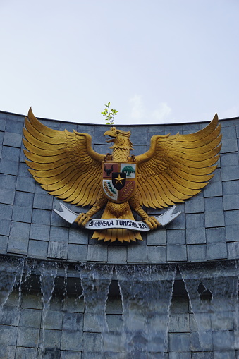 Tulung Agung, East Java, Indonesia - Mei 10st, 2021 : Garuda Pancasila (Indonesian five principles) with a natural background