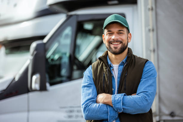 istock Happy confident male driver standing in front on his truck 1867550757