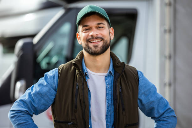 istock Happy confident male driver standing in front on his truck 1867552408