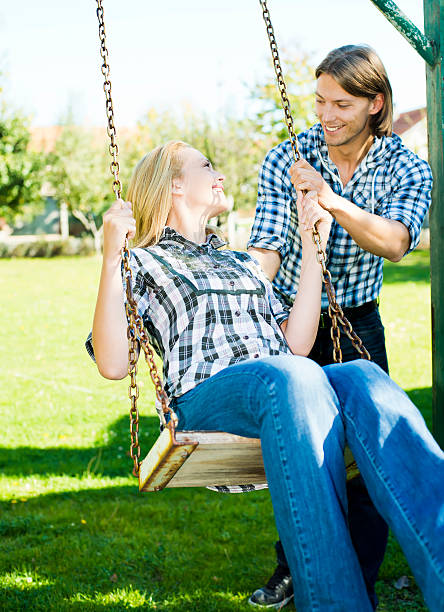 istock Couple enjoying at swing 186757414
