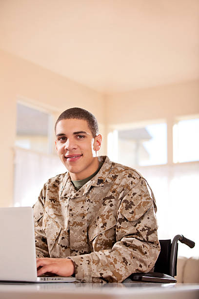 istock US Marine studyng at home on a laptop 186757605