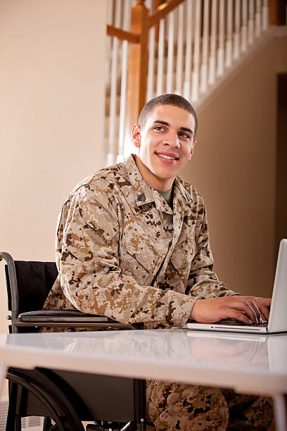 istock US Marine studyng at home on a laptop 186757608