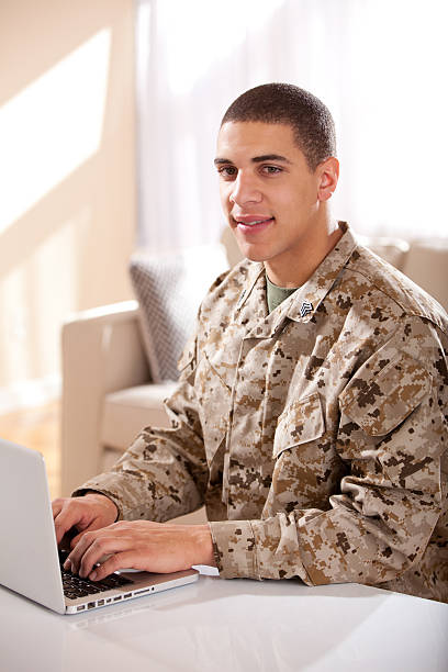 istock US Marine studyng at home on a laptop 186757609