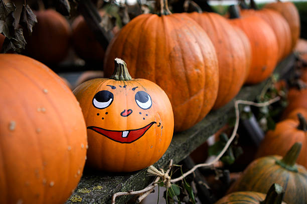 istock Painted grimace on pumpkin for Halloween 186758202