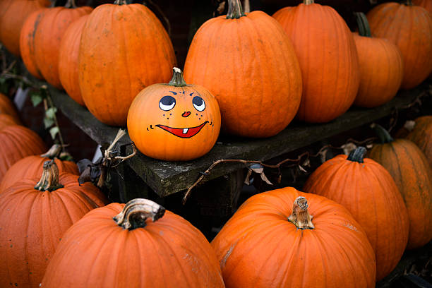 istock Painted grimace on pumpkin for Halloween 186758204