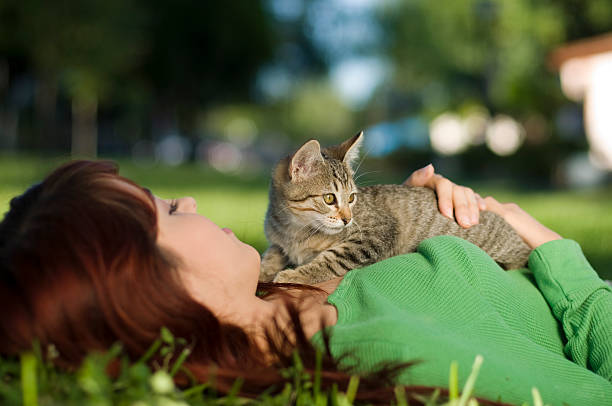 istock Teenager watching a kitten 186758735