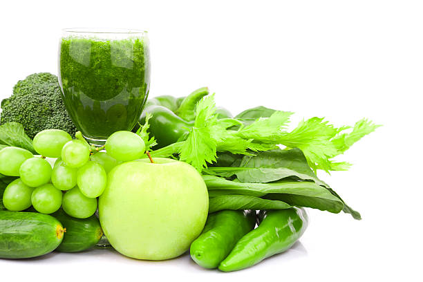 istock Green juice and Vegetable variety isolated on white background 186759998