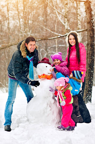istock Family in a winter park 186761155