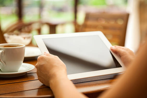 istock A businesswoman on her digital tablet drinking coffee 186762788