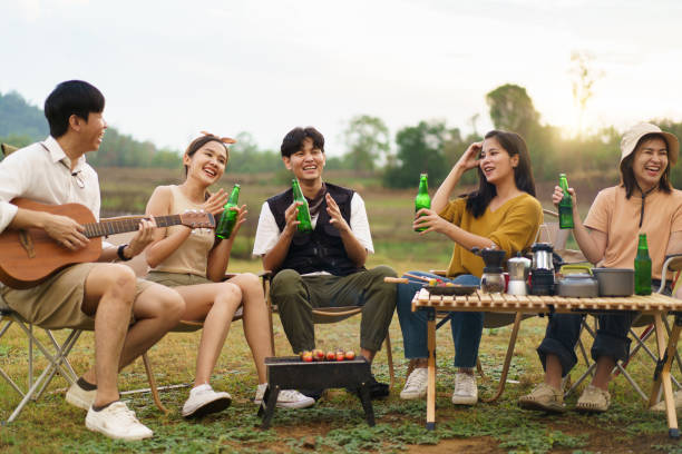 istock Asian people enjoy cooking and camping party together. 1867629514