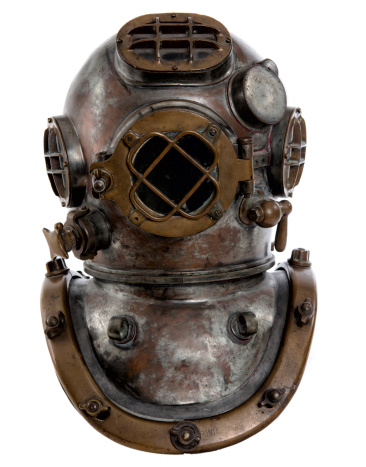 This is the Mark Five diving suit. (MkV) It was first produced in the 1920's and was the Navy's most widely used underwater garment. Total, the suit weighed about 200 pounds above water, and it was very cumbersome. It was used until the 1970's, when SCUBA gear outphased surface-supplied dry dives. 