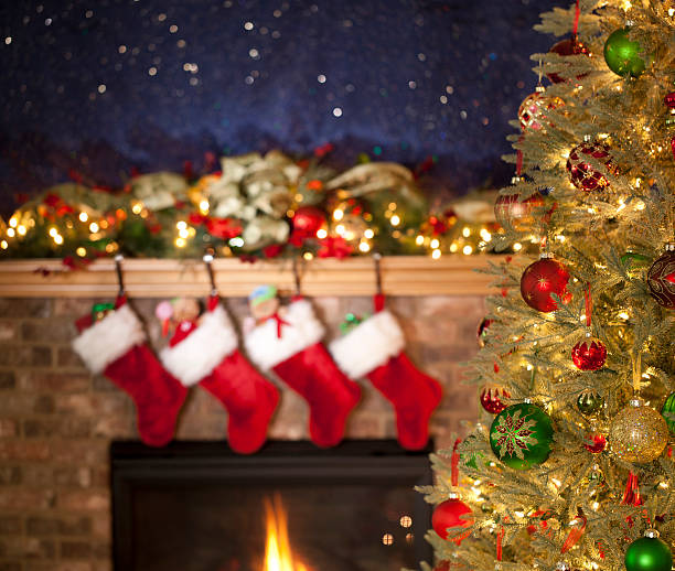 istock Christmas Tree in front of the Fireplace 186763203