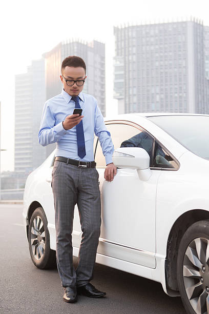 istock Smiling businessmen drive a car 186763283
