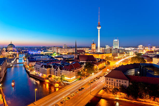 Skyline of Berlin (Germany) with TV Tower at dusk Aerial View of the TV tower, Berlin town hall and Cathedral at dusk east berlin photos stock pictures, royalty-free photos & images