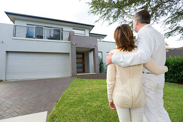 istock Mature couple looking at a house 186763774