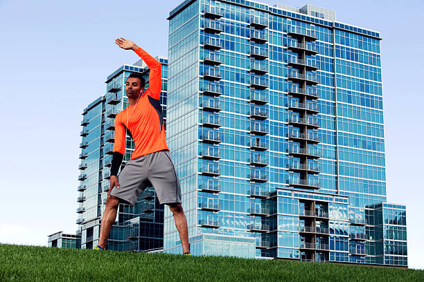 istock Man Doing Stretches In A City Park 186763958