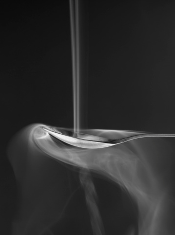 Smoke pouring down on the spoon