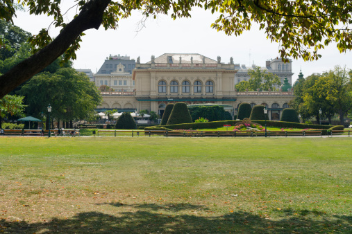 The Viennese City Park in the first district in vienna - capitol of austria (in german: Wiener Stadtpark). In the background: the Kursalon, a building of historicism in the Italian Renaissance style in Vienna. A place for various events.