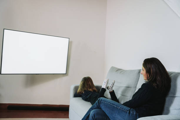 istock Mother and daughter watching TV 1867652003
