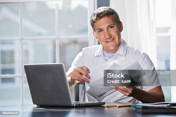 Paying Bills Stock Photo - Download Image Now - Envelope, Holding, Smiling